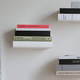 Umbra’s Conceal Floating Bookshelf feature a special design that creates the illusion of your books actually floating on your wall.